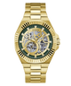 Gold-tone Guess automatic watch with a skeleton dial, green inner ring, and gold link bracelet on a white background.