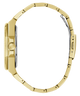 A close-up side view of a gold-tone metal watch bracelet and case, showing the crown, side lugs, and clasp mechanism on a plain white background.