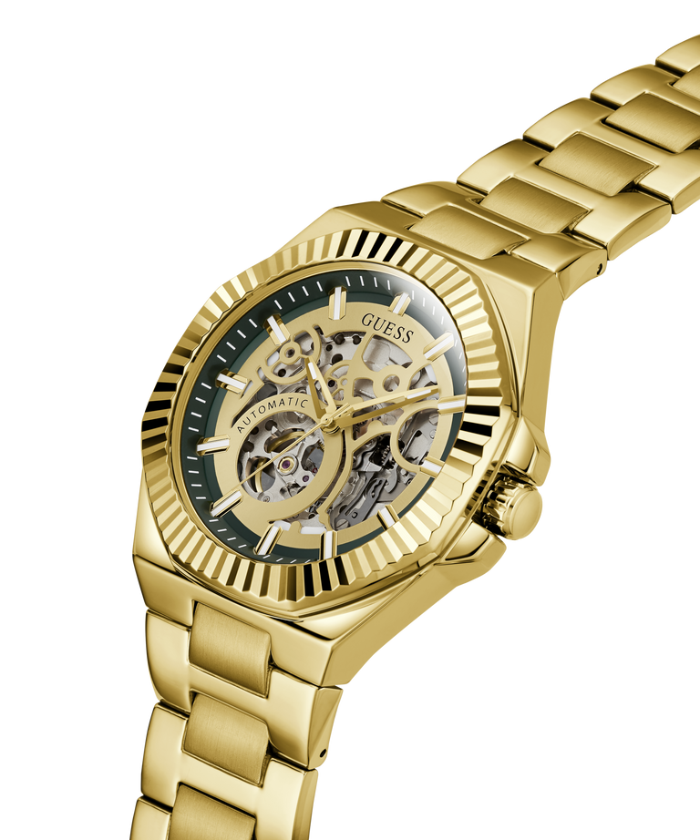 Gold-tone automatic watch with a skeleton dial and matching gold-tone metal link bracelet, shown on a clean white background. lifestyle