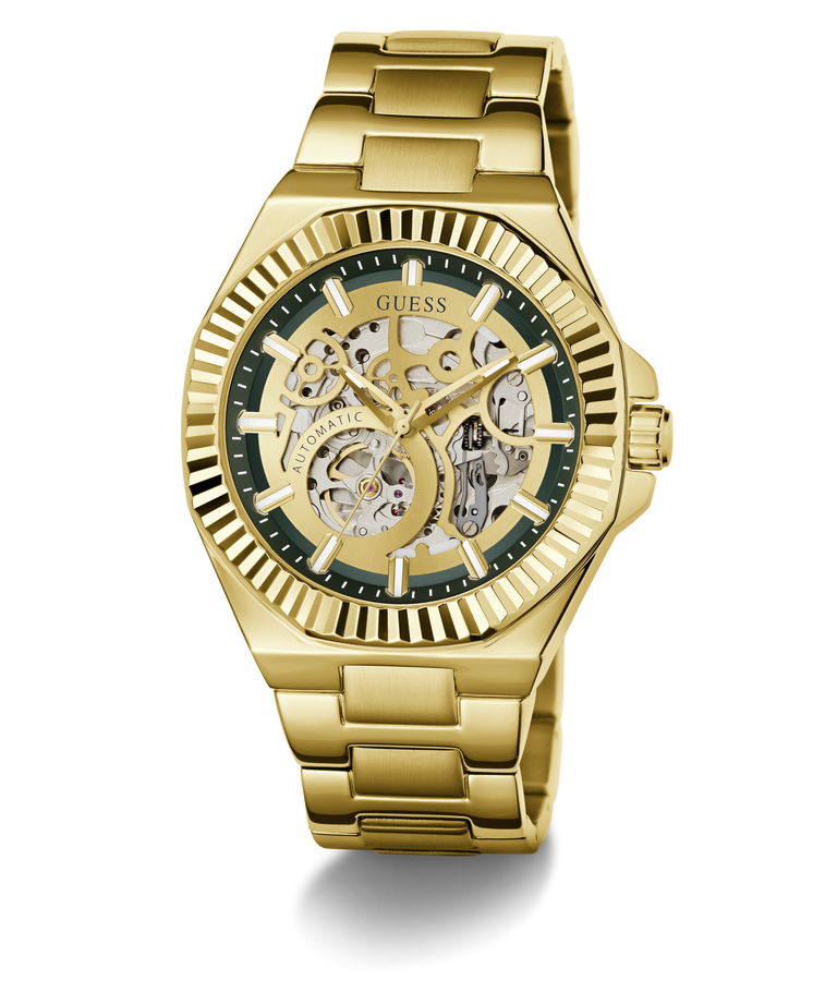 Gold-tone GUESS wristwatch with a skeleton dial, featuring a gold metal link bracelet, ridged bezel, and dark green inner dial details.