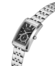 A GUESS men's stainless steel analog watch with a rectangular case, black textured dial, and matching steel link bracelet, shown on a clean white background. lifestyle