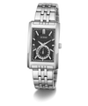 A GUESS men's analog watch with a silver stainless steel case and link bracelet, featuring a black textured dial with silver-tone hands and markers.