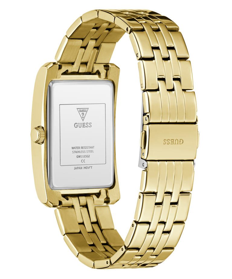 Gold-tone stainless steel women's watch with a rectangular case and matching metal link bracelet, shown on a white background. The back of the case is visible with GUESS branding and technical specifications, and the clasp also shows the GUESS logo.