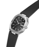 A Guess wristwatch with a black dial, silver-tone case, and black leather strap, shown on a plain white background. lifestyle