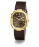 A GUESS wristwatch with an octagonal gold-tone case, a dark brown dial, and a matching brown leather strap, shown on a clean white background.