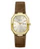A Guess wristwatch with an octagonal gold-tone case, a cream-colored dial with gold hands and markers, and a brown alligator-textured leather strap, shown against a plain white background.