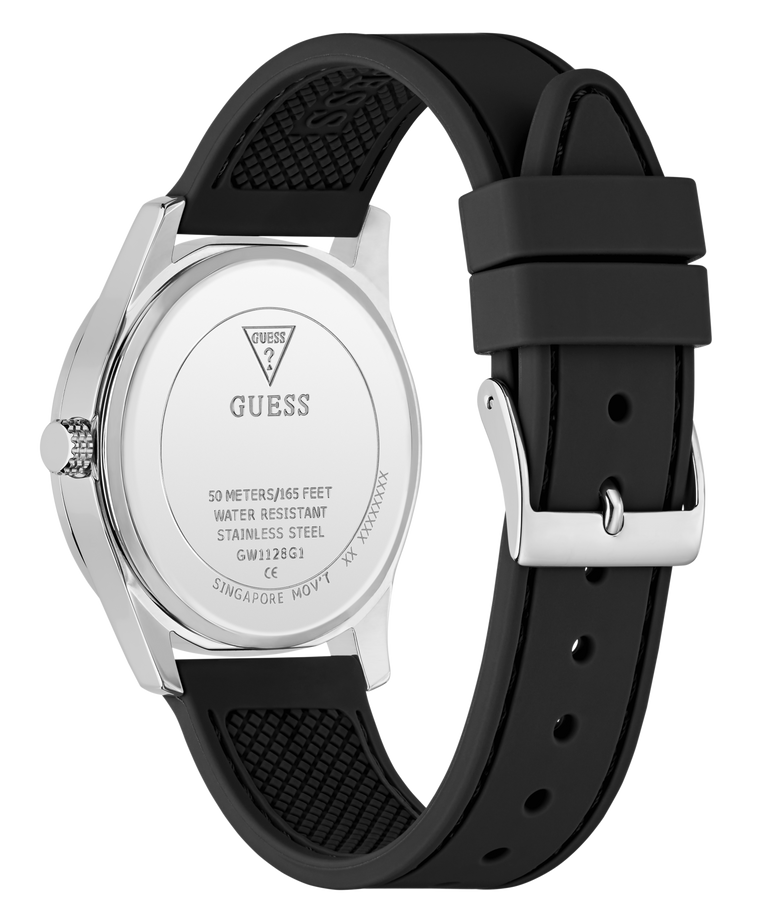 A close-up shot of a Guess watch showing the back of the silver stainless steel case and its black textured silicone strap, set against a plain white background.