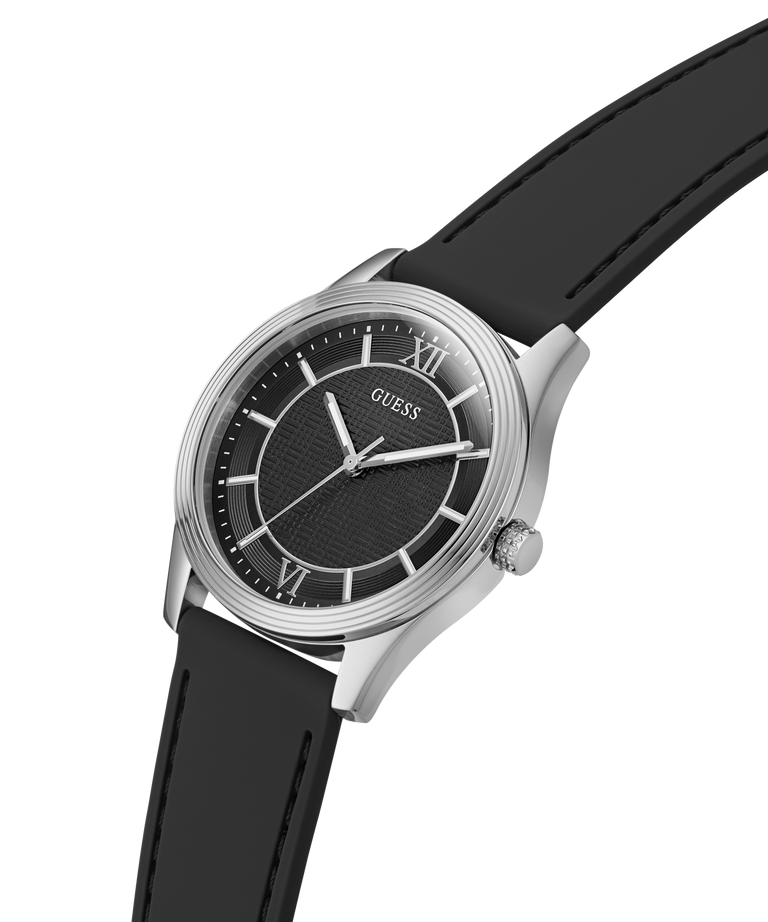 A Guess wristwatch with a black dial, silver-tone stainless steel case, and a black leather strap, shown against a solid white background. lifestyle