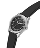 A Guess wristwatch with a black dial, silver-tone stainless steel case, and a black leather strap, shown against a solid white background. lifestyle