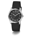 A GUESS men's analog watch featuring a black textured dial, silver-tone stainless steel case, and a black rubber strap, shown against a plain white background.