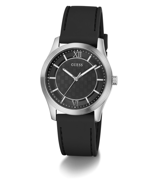 A GUESS men's analog watch featuring a black textured dial, silver-tone stainless steel case, and a black rubber strap, shown against a plain white background.