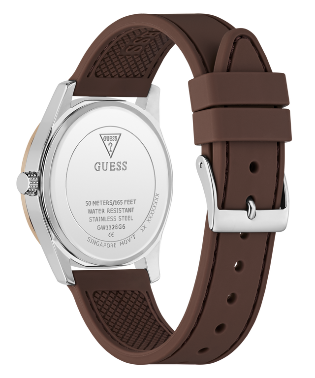 A close-up shot of a Guess watch showing the back of the silver stainless steel case and its black textured silicone strap, set against a plain white background.
