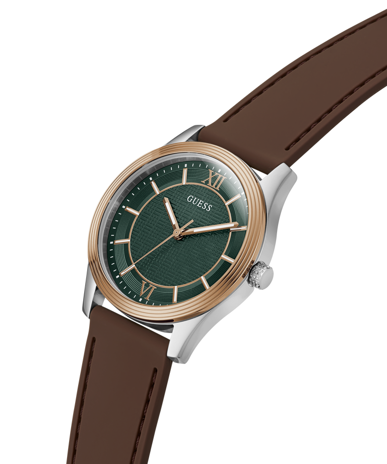 A GUESS men's watch featuring a dark green dial, a rose gold-tone bezel and indices, and a brown leather strap, shown on a clean white background. lifestyle