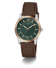 A GUESS men's watch featuring a dark green textured dial, a rose gold-tone case, and a brown leather strap, shown on a clean white background.