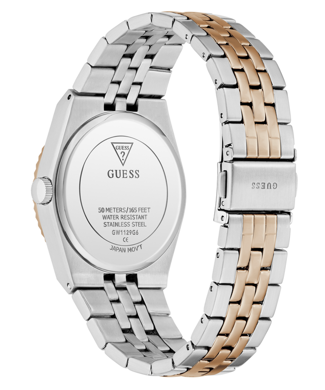 A close-up rear view of a GUESS wristwatch with a two-tone stainless steel and rose gold link band, showing the branded back cover and clasp on a white background.