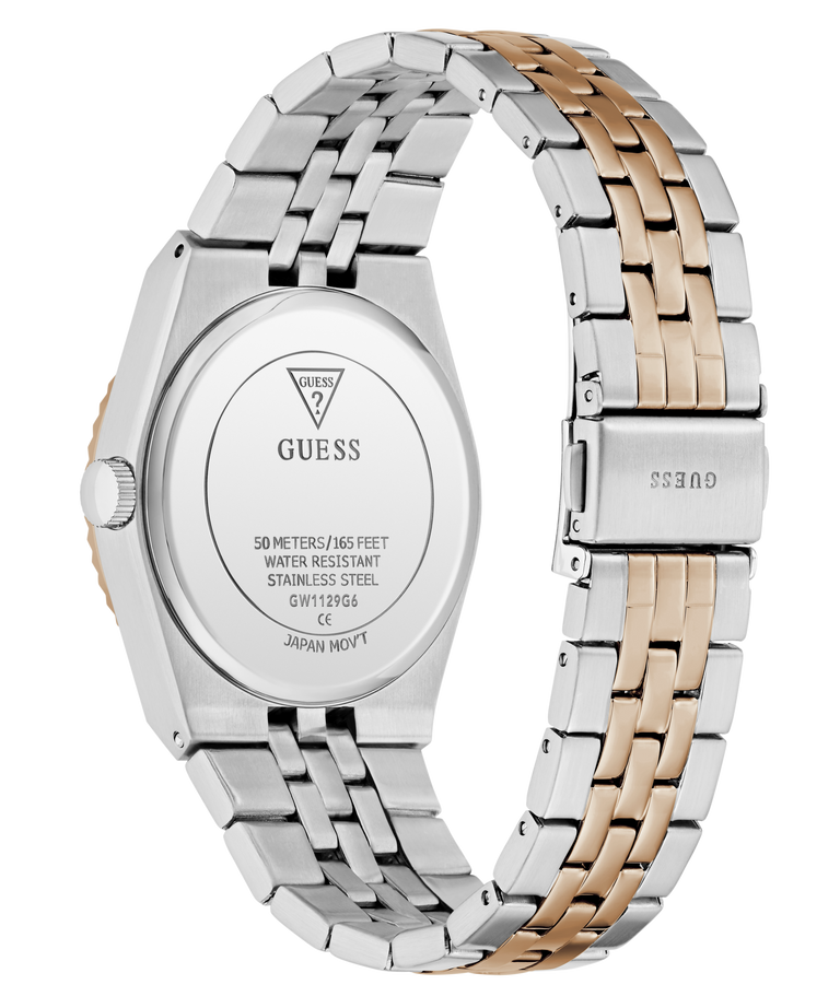 A close-up rear view of a GUESS wristwatch with a two-tone stainless steel and rose gold link band, showing the branded back cover and clasp on a white background.