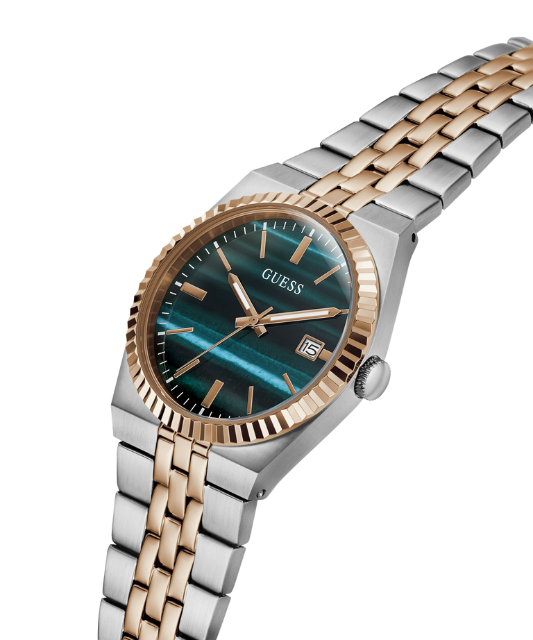 A GUESS men's watch featuring a two-tone silver and rose gold stainless steel and bracelet, with a distinctive teal-blue marbled dial and a fluted rose gold bezel. lifestyle