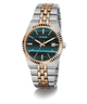 A Guess men's two-tone stainless steel and rose gold watch with a dark green tiger-stripe dial and a fluted bezel, shown on a white background with a soft shadow.