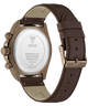 Back view of a GUESS watch with a bronze-toned case and a dark brown leather strap, showing the water-resistant stainless steel case back and buckle.