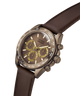 A Guess Chronograph watch with a dark brown dial, brown leather strap, and a bronze-toned case with gold-tone accents on the subdials and hands. lifestyle