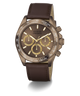 A Guess chronograph watch with a bronze-toned case, brown dial, three gold subdials, and a brown leather strap, shown on a clean white background.
