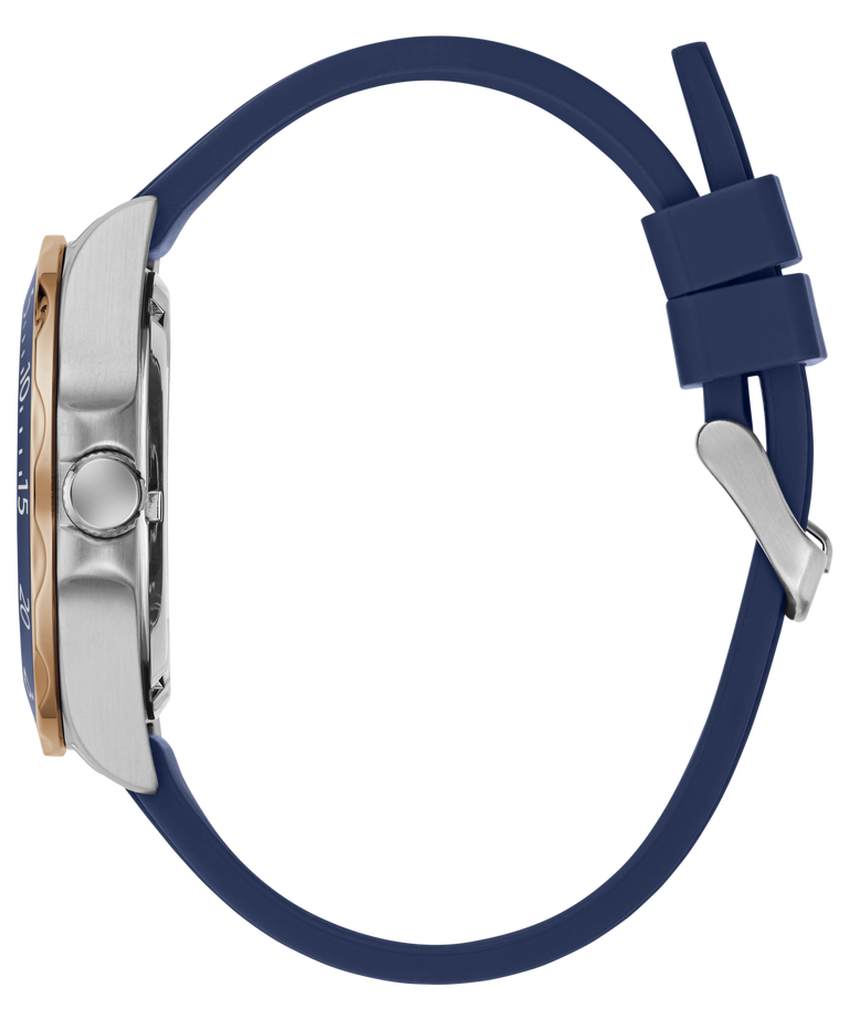 Side profile of a wristwatch with a navy blue silicone strap, a brushed silver-tone case, and a small rose gold accent on the bezel, shown on a plain white background.