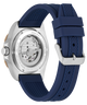 Ronda watch shown from the back, featuring a silver stainless steel case with a visible mechanical movement and a textured navy blue silicone strap with a silver buckle.