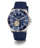 A GUESS Automatic watch with a blue dial, blue textured silicone strap, and a silver-tone stainless steel case accented with a gold-tone case bezel and skeletonized inner dial.