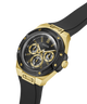 A Guess men's chronograph watch featuring a black and gold-tone case, a black dial with gold subdials and markers, and a black rubber strap, shown on a solid white background. lifestyle