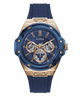 A Guess men's watch featuring a blue silicone strap, a blue dial with gold-tone subdials and hands, and a gold-tone case accented with screws.
