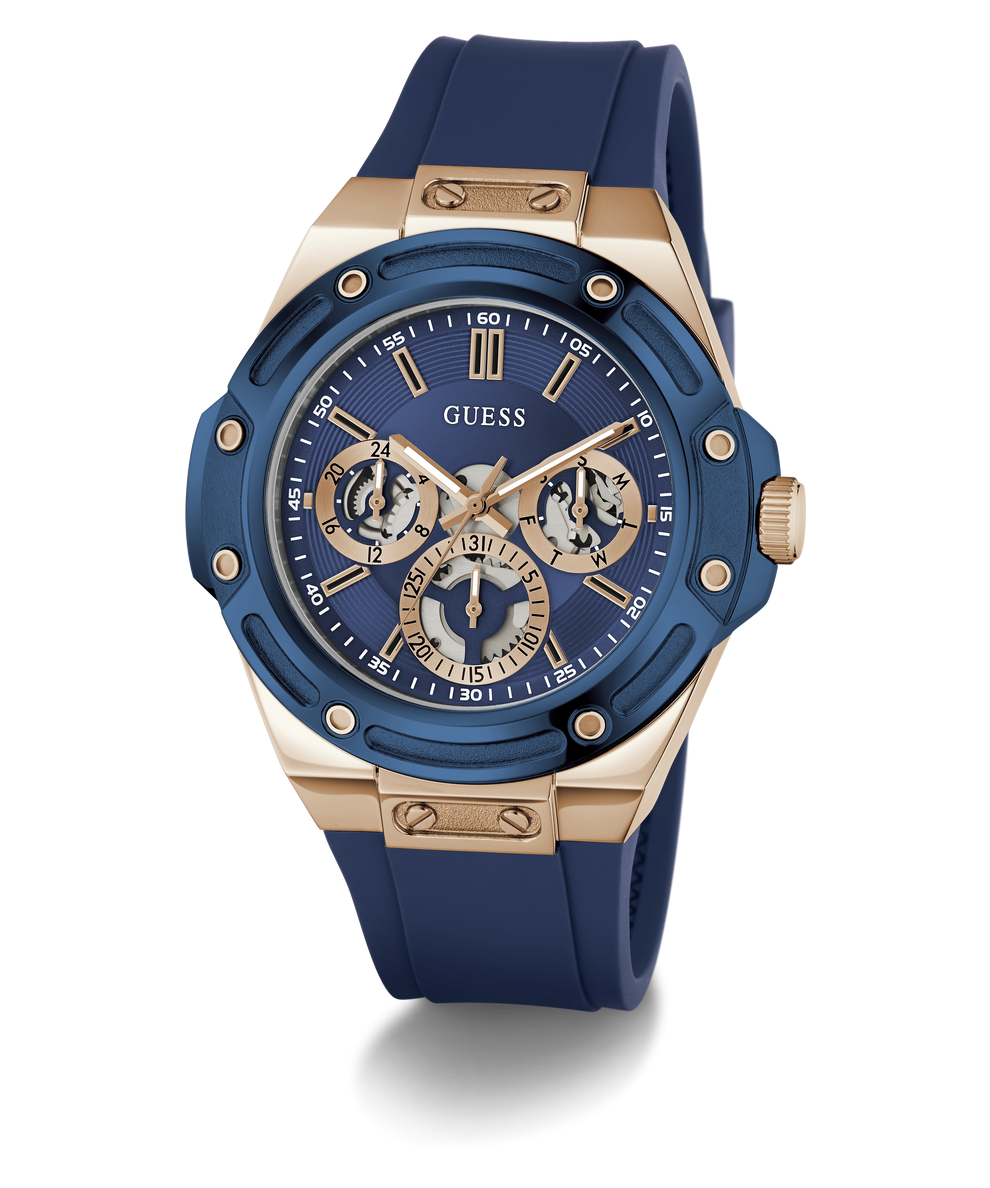 A GUESS men's chronograph watch featuring a blue bezel and blue silicone strap, paired with a rose gold-tone case and a blue dial with gold-tone subdials.