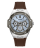 A Guess men's watch featuring a silver stainless steel case, a light blue dial with three sub-dials, and a brown silicone strap, shown against a plain white background.