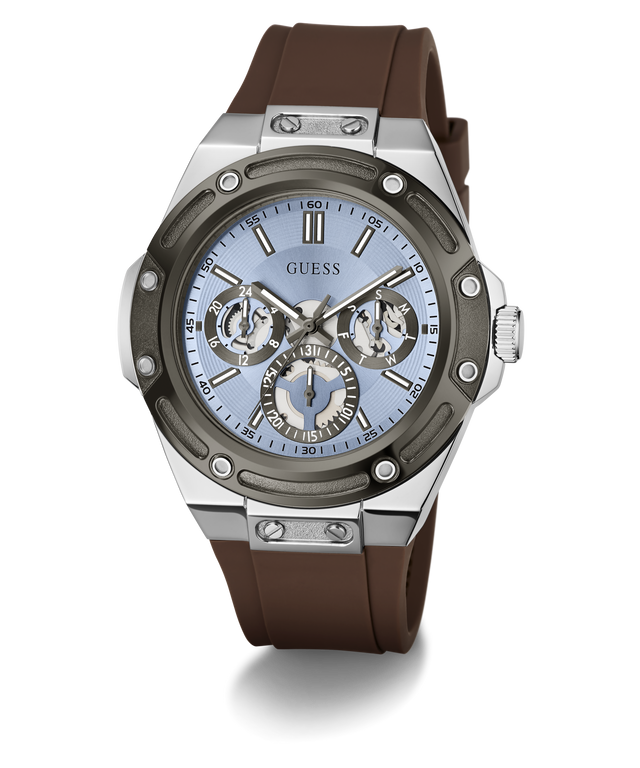 A GUESS men's watch featuring a brown silicone strap, a silver-toned stainless steel case, and a light blue dial with chronograph sub-dials.