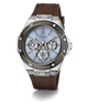 A GUESS men's watch featuring a brown silicone strap, a silver-toned stainless steel case, and a light blue dial with chronograph sub-dials.