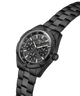 A black Guess analog watch with a multi-dial chronograph face and a matching black link bracelet, shown on a clean white background. lifestyle