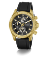 A Guess men's chronograph watch featuring a textured gold-tone case, a black dial with gold-tone subdials and markers, and a black rubber strap, shown on a white background with a soft shadow.