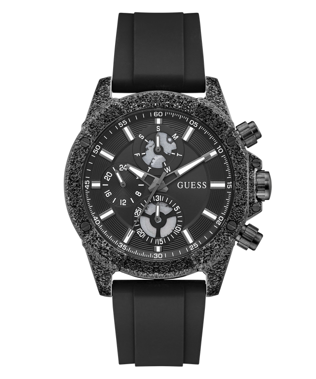 A GUESS chronograph watch with a textured dark gray and black case, a black dial with white markings, and a black silicone strap, shown against a plain white background.