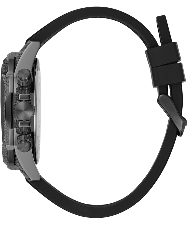 A close-up side view of a watch with a textured dark gray case, a black rubber strap, and a black magnetic clasp, shown against a plain white background.