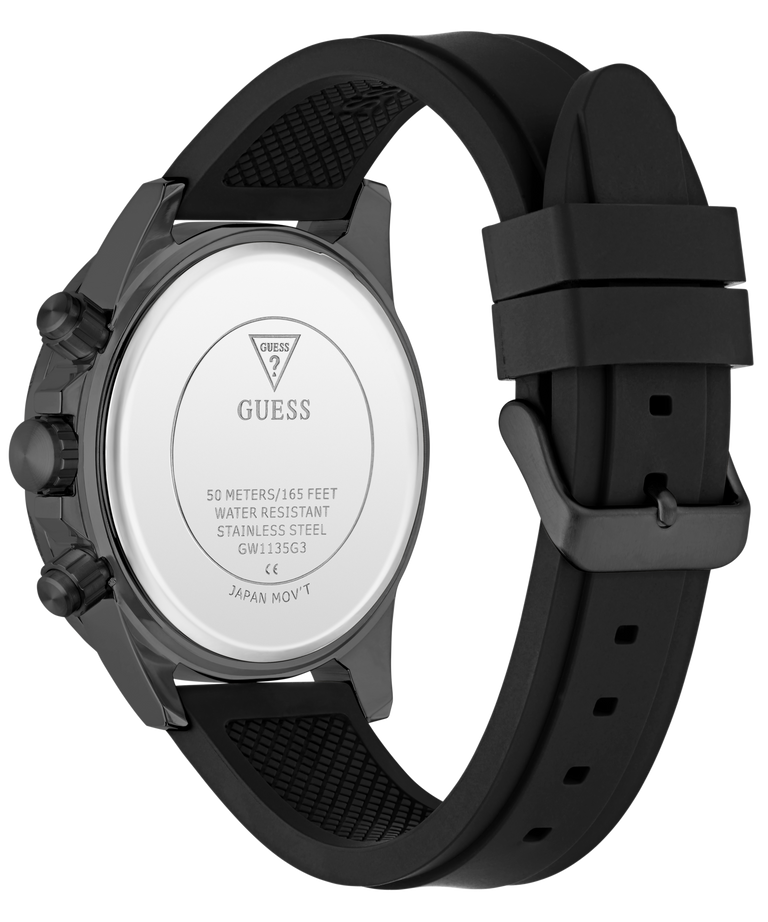 The back view of a Guess watch with a black silicone strap and a dark gray metallic case, showing the branded water-resistant case back.