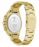 Gold-tone stainless steel watch with a metal link bracelet, shown from the back. The case has two side pushers, and the back cover displays the GUESS logo and specifications.