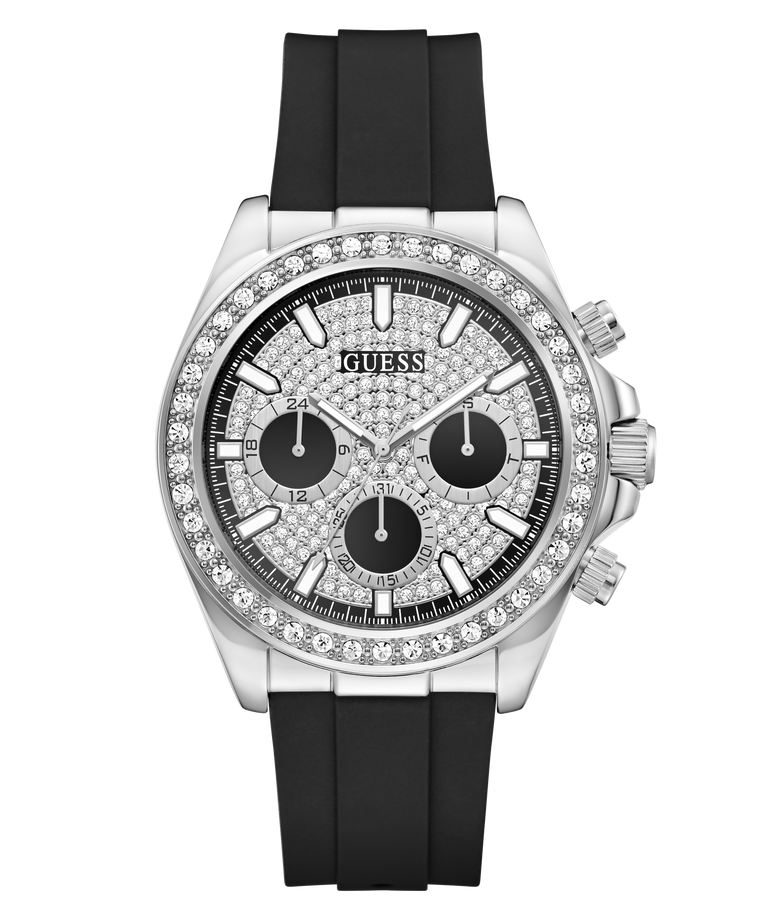 A Guess chronograph watch with a silver-tone case, a bezel encrusted with clear stones, a black dial with three subdials, and a black rubber strap, shown on a plain white background.