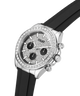 A Guess wristwatch with a silver-tone case, crystal-encrusted bezel, textured silver dial with three black subdials, and a black rubber strap, shown on a white background. lifestyle