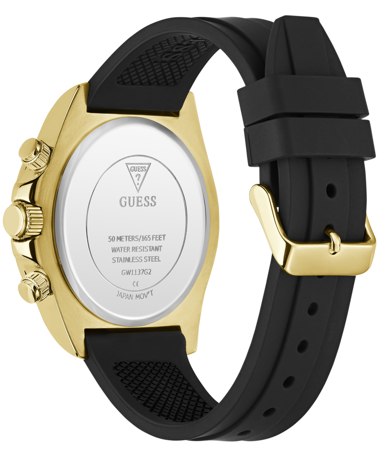 Back view of a Guess watch with a gold-tone case and a black silicone strap, showing the branded back plate and crown details.