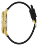 A luxury watch shown in a side profile view, featuring a highly detailed gold-toned case and a black silicone strap with a gold-toned clasp, set against a solid white background.