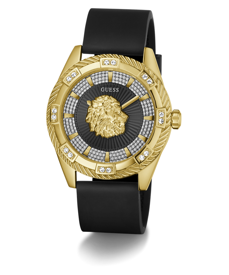 A luxury wristwatch by GUESS featuring a gold-tone case with a lion head dial, a black leather strap, and a bezel accented with diamonds.