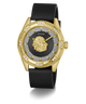 A luxury wristwatch by GUESS featuring a gold-tone case with a lion head dial, a black leather strap, and a bezel accented with diamonds.