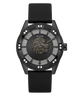 A luxury GUESS watch featuring a black ceramic case, a black strap, and a detailed black dial with a central lion head motif and crystal accents.