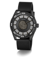 A luxury Guess wristwatch featuring a black rubber strap, a black case, and a highly detailed black dial with a central lion head motif, surrounded by rows of sparkling clear crystals.