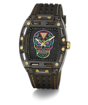 A luxury wristwatch with a black carbon fiber case, a black textured strap with yellow stitching, and a colorful Day of the Dead sugar skull dial. The watch features gold-tone screws and hands, and is photographed on a clean white background with a soft shadow.