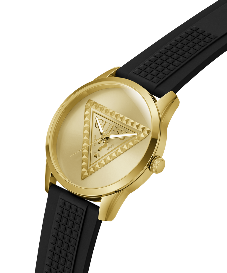 A gold-tone Guess wristwatch with a textured black silicone strap, shown at an angle on a solid white background. lifestyle